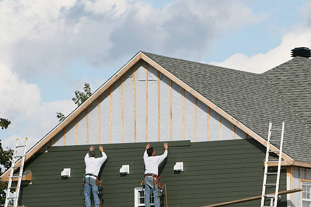 Professional Storm Damage Siding Repair technician working in East Rochester, OH
